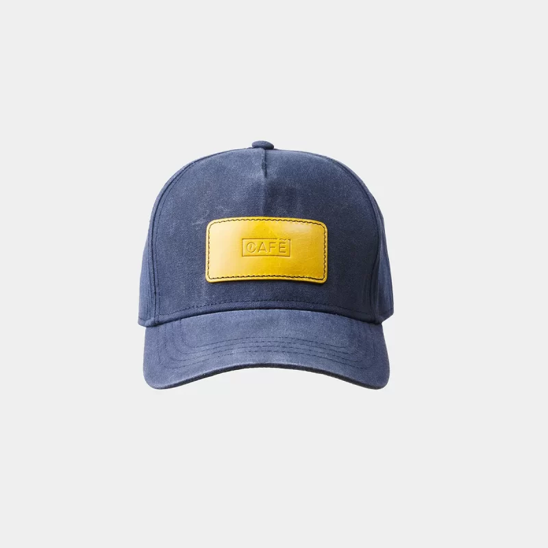 Blue cap with leather yellow patch.